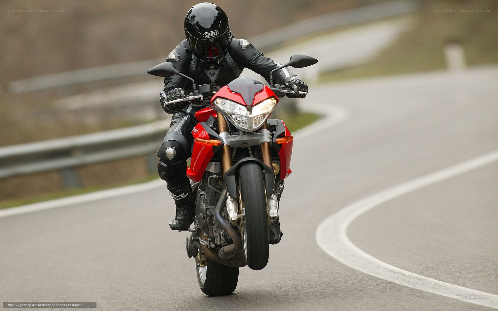 motorcyclist on red bike