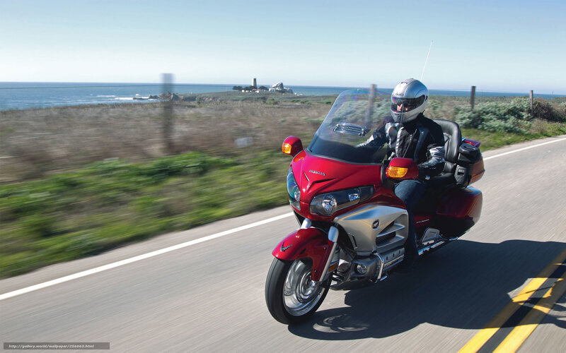 Motorcyclist on Red Motorcycle — Serene