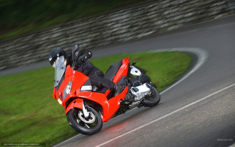 Motorcyclist on Red Scooter — Dynamic, Photograph