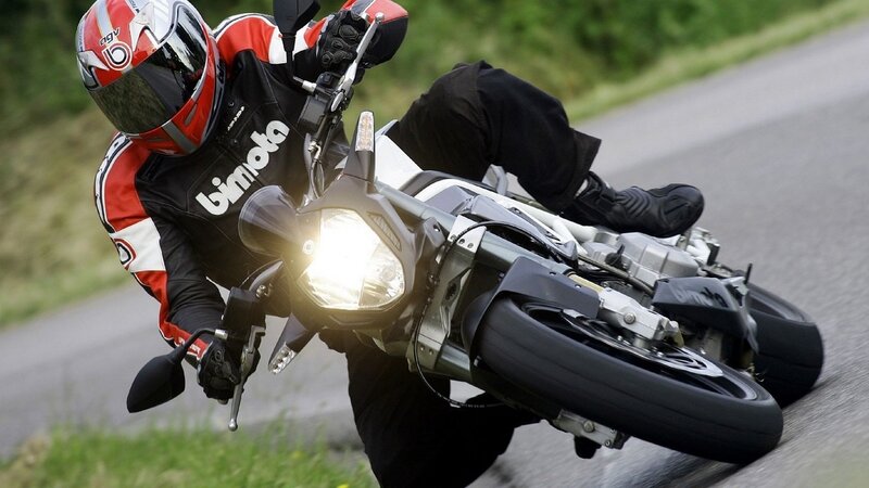 Motorcyclist on Road — Black, Dynamic, Afternoon, Photograph, Grass, Helmet, Red
