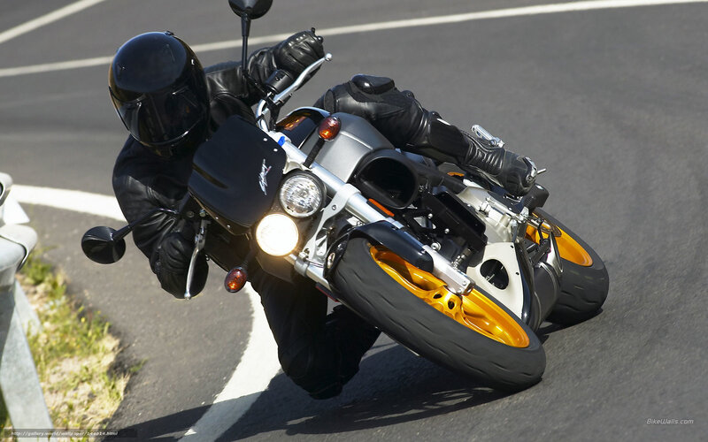 Motorcyclist on Road — Black, Dynamic, Afternoon, Photograph, Guardrail, Helmet