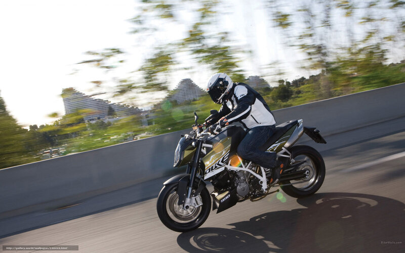 Motorcyclist on Road — Black, Dynamic, Afternoon, Photograph, Helmet, Buildings