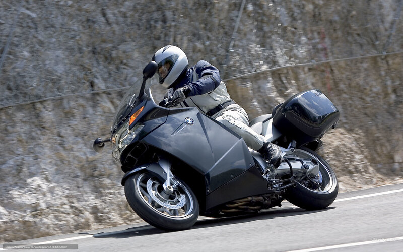 Motorcyclist on Road — Black, Dynamic, Afternoon, Photograph, Helmet, Rock Wall