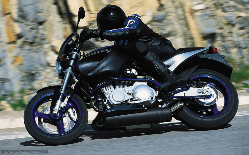 Motorcyclist on Road — Black, Dynamic, Afternoon, Photograph, Rocky Cliff