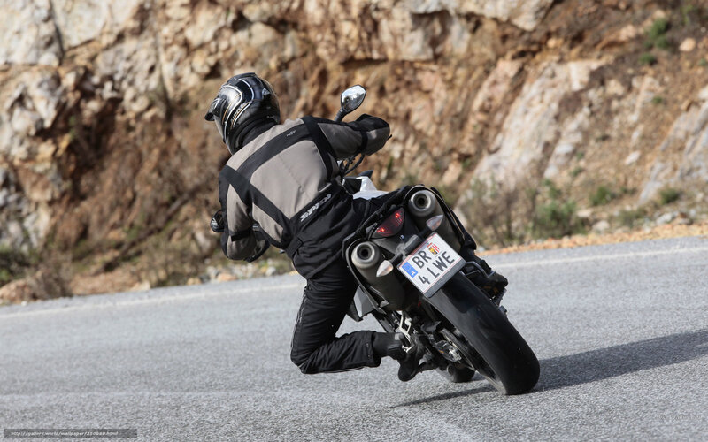 Motorcyclist on Road — Gray, Dynamic, Afternoon, Photograph, Rocky Cliff