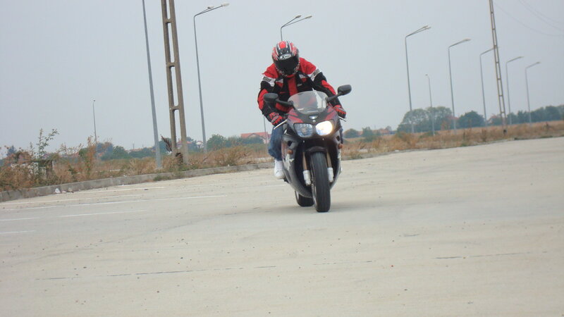 Motorcyclist on Road — Gray, Overcast