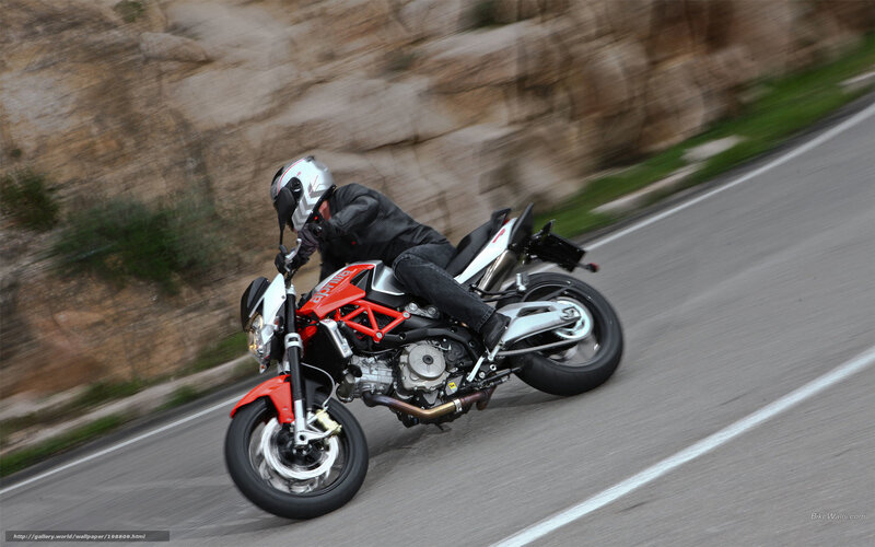 Motorcyclist on Road — Red, Dynamic, Afternoon, Photograph, Rocky Hillside