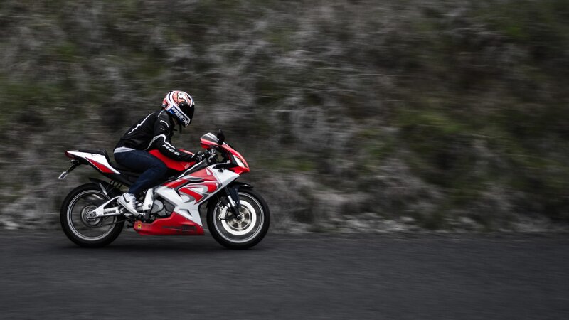 Motorcyclist on Road — Red, Dynamic, Photograph, Helmet