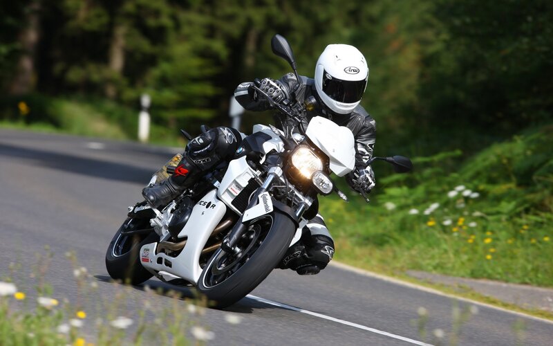 Motorcyclist on Road — White, Dynamic, Afternoon, Photograph, Trees, Grass, Black, Green