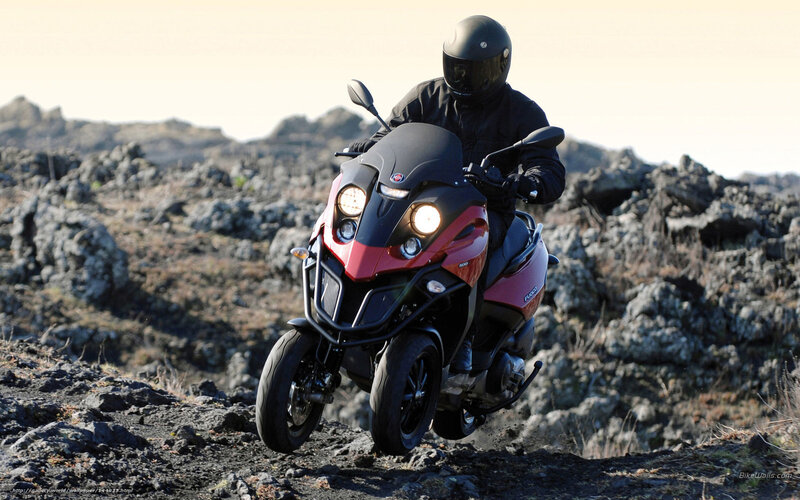Motorcyclist on Rocky Terrain — Black