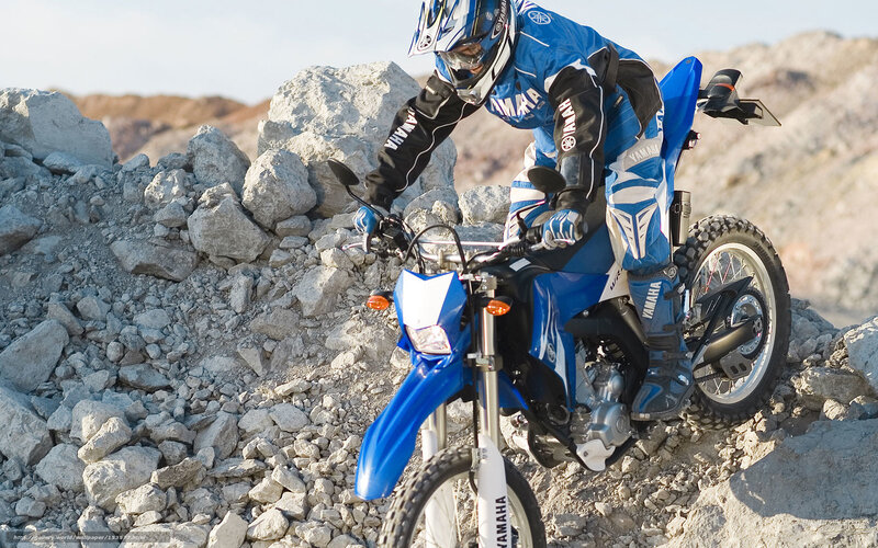 Motorcyclist on Rocky Terrain — Blue, Action