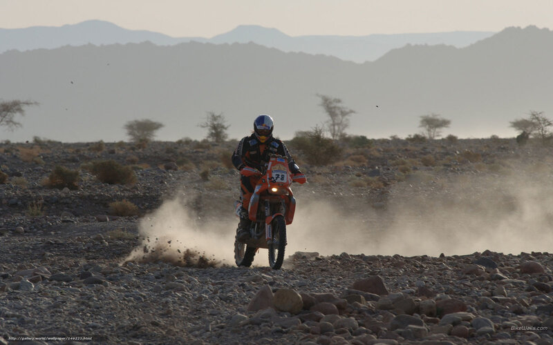 Motorcyclist on Rocky Terrain — Orange
