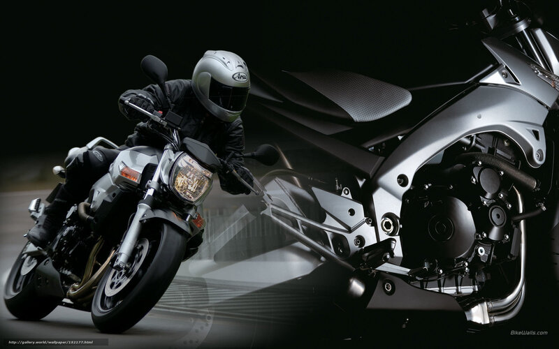 Motorcyclist on Silver Bike — Dramatic