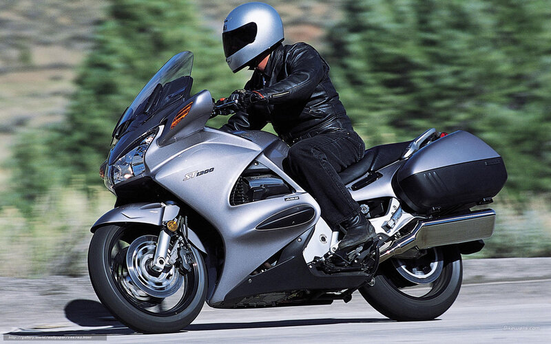 Motorcyclist on Silver Bike — Dynamic, Afternoon, Photograph, Helmet