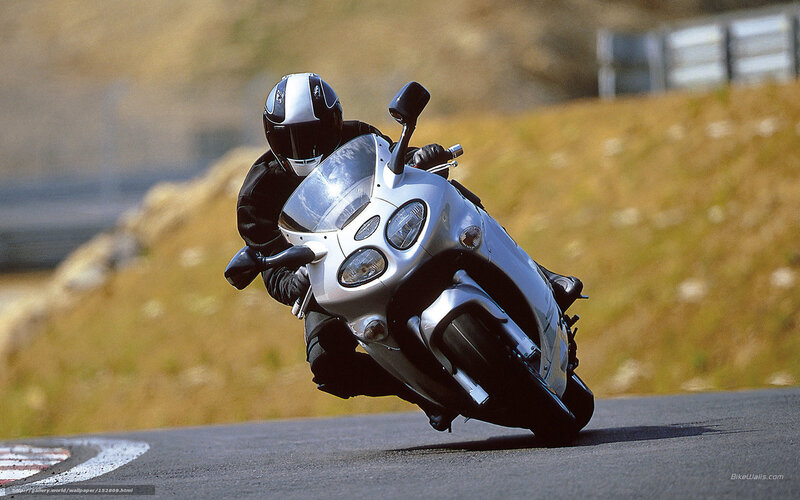 Motorcyclist on Silver Bike — Dynamic, Afternoon, Photograph, Road