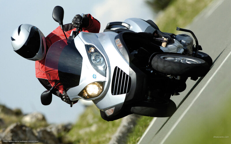 Motorcyclist on Silver Scooter