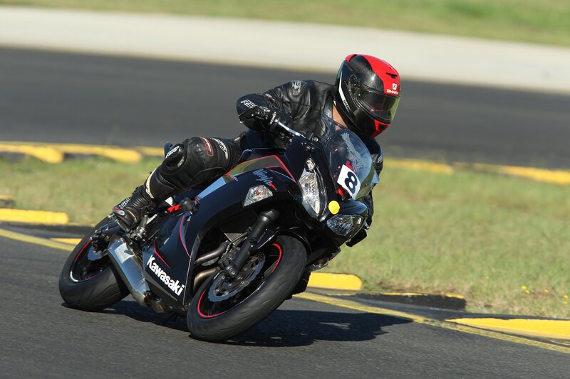 Motorcyclist on Track — Black, Dynamic, Afternoon, Photograph, Helmet, Race Track, Motorcycle