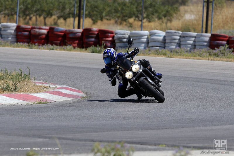 Motorcyclist on Track — Blue, Dynamic, Afternoon, Photograph, Motorcycle, Helmet