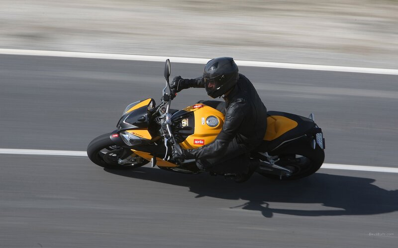 Motorcyclist on Track — Yellow, Dynamic, Afternoon, Photograph, Motorcycle, Rider