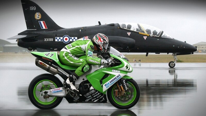 Motorcyclist on Wet Tarmac — Green, Dramatic