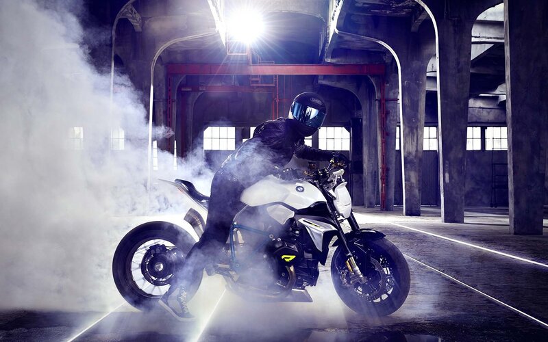 Motorcyclist on White Bike — Dramatic