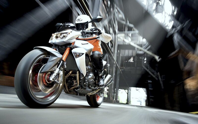 Motorcyclist on White Bike — Dynamic