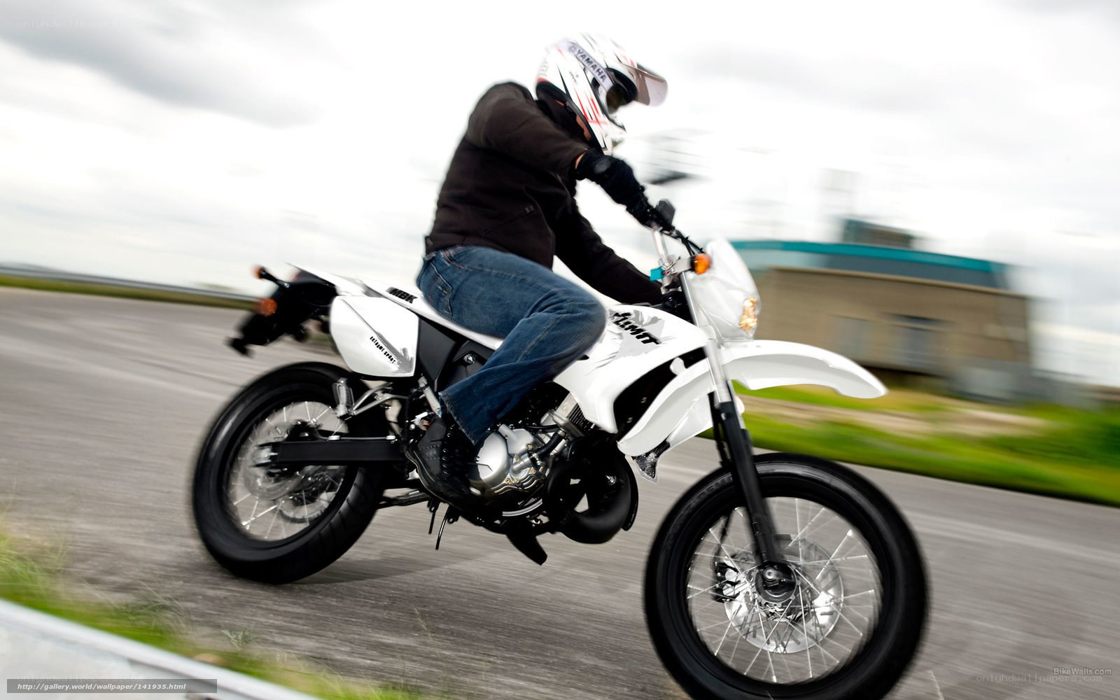 motorcyclist on white bike