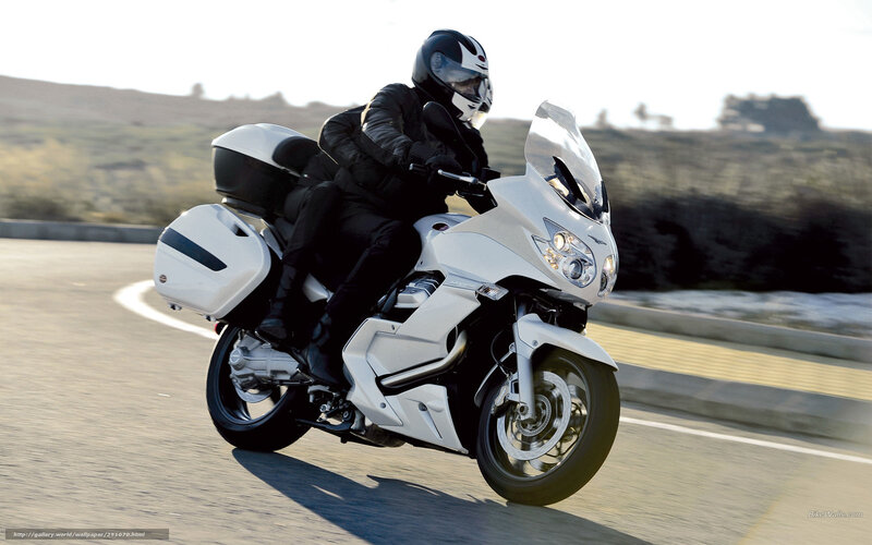 Motorcyclist on White Motorcycle