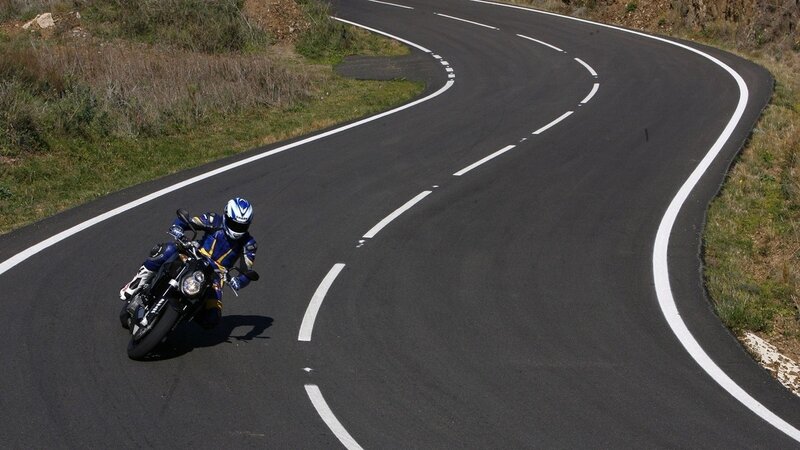 Motorcyclist on winding road
