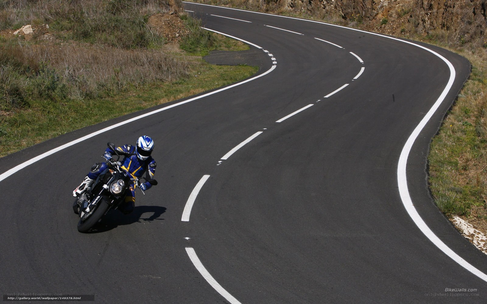 Motorcyclist on winding road