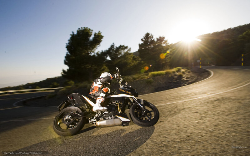 Motorcyclist on Winding Road — Black, Dramatic, Sunset, Photograph
