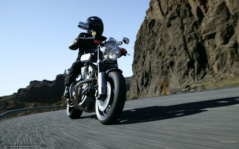 Motorcyclist on Winding Road — Black, Dynamic, Afternoon, Photograph, Cliff, Helmet