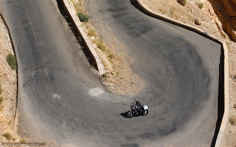 Motorcyclist on Winding Road — Gray, Dramatic, Afternoon