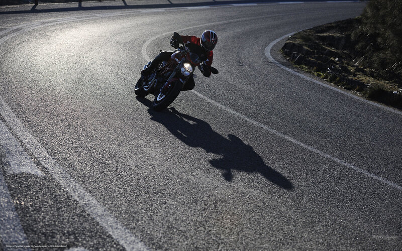 Motorcyclist on Winding Road — Gray, Dramatic, Sunset