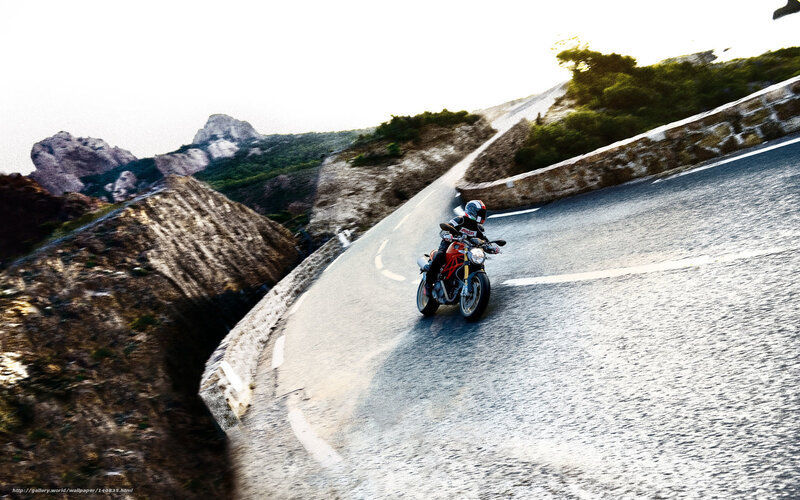 Motorcyclist on Winding Road — Gray, Dramatic