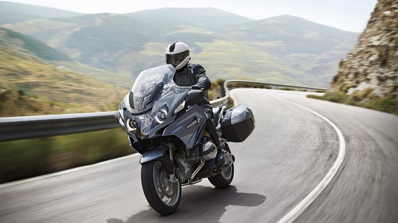 Motorcyclist on Winding Road — Gray, Dynamic, Afternoon, Photograph, Motorcycle