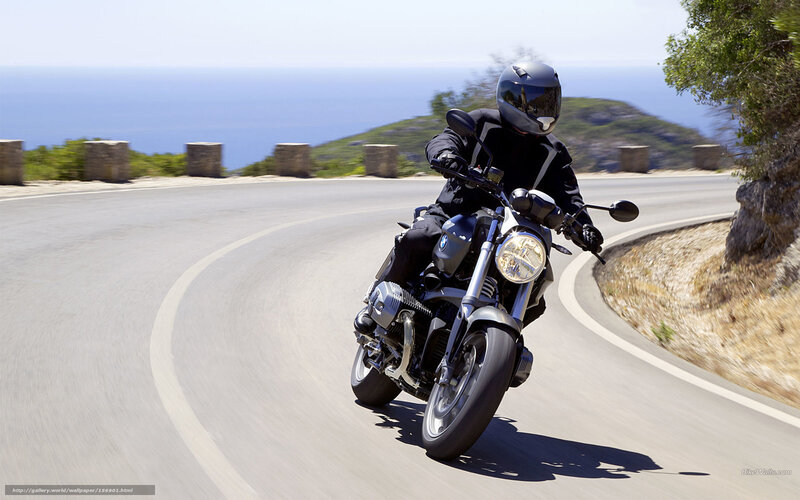 Motorcyclist on Winding Road — Gray, Dynamic, Afternoon, Photograph, Ocean