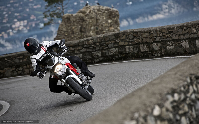 Motorcyclist on Winding Road — Gray, Dynamic, Afternoon, Photograph, Stone Wall