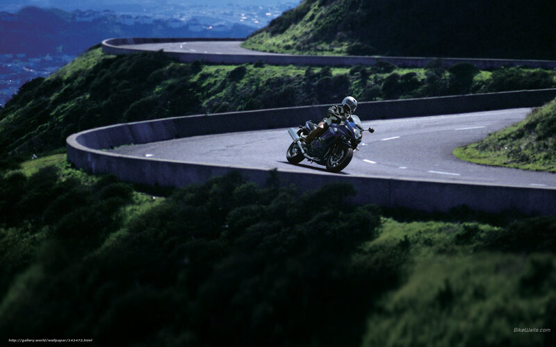 Motorcyclist on Winding Road — Green, Dramatic