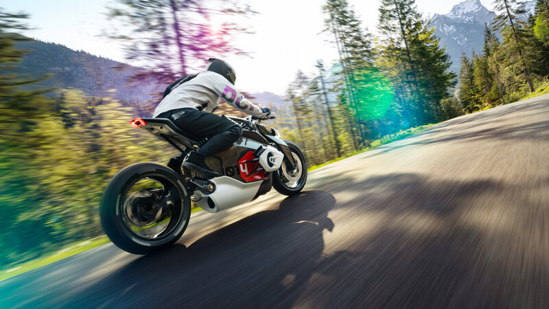 Motorcyclist on Winding Road — Green, Dynamic, Afternoon, Photograph, Mountains