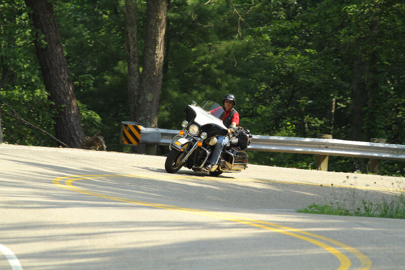 Motorcyclist on Winding Road — Green