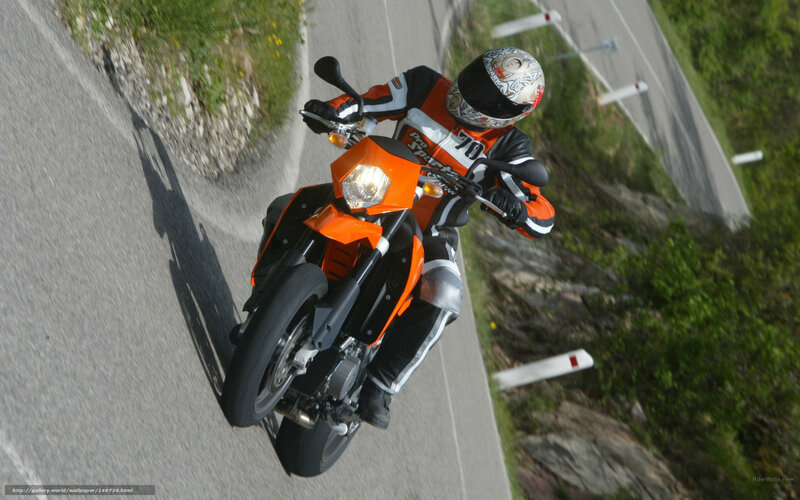 Motorcyclist on Winding Road — Orange, Dynamic, Afternoon, Photograph, Helmet