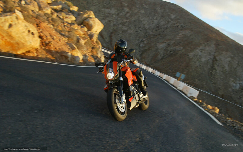 Motorcyclist on Winding Road — Orange