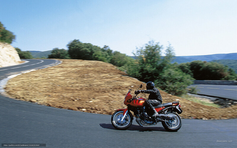 Motorcyclist on Winding Road — Red, Serene