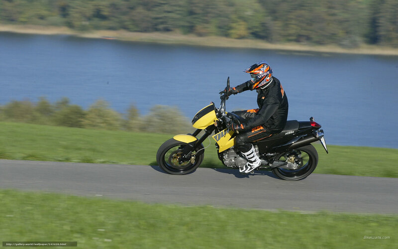 Motorcyclist on Yellow Bike — Active
