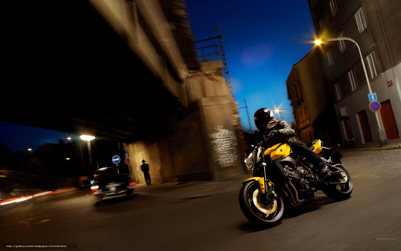 Motorcyclist on Yellow Bike — Dramatic, Night