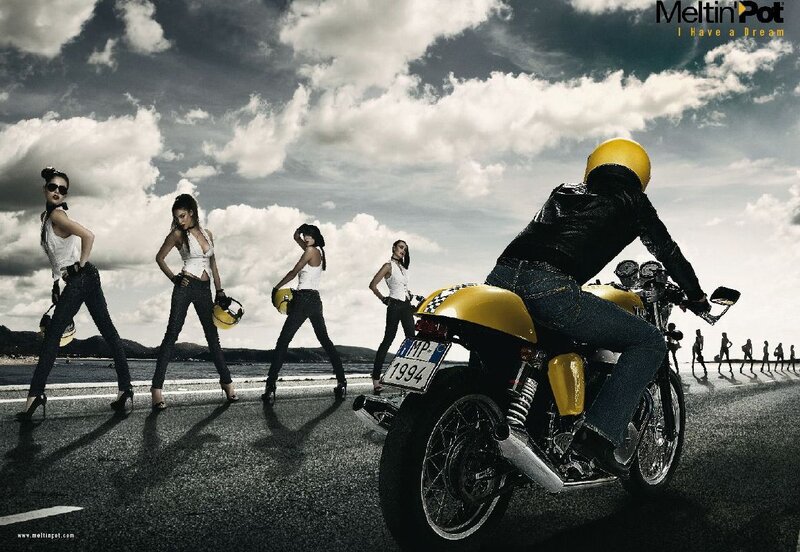 Motorcyclist on Yellow Bike — Dramatic