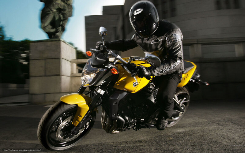 Motorcyclist on Yellow Bike — Dynamic, Afternoon, Photograph, Statue