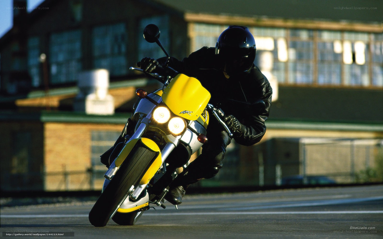 Motorcyclist on yellow bike