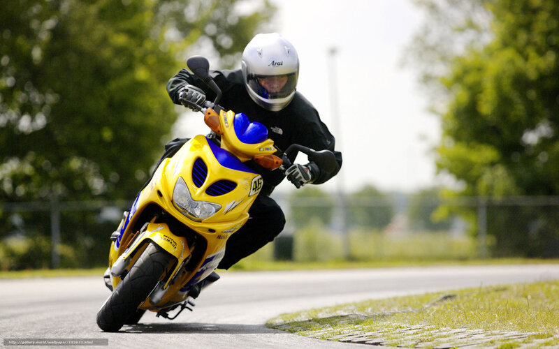 Motorcyclist on Yellow Scooter — Dynamic